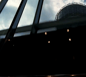 Moving image of a glass elevator going up to depict the 10th house being at the top pf the astrology chart