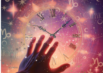 A hand reaching out to Clock hands aligning with zodiac Capricorn and Scopio symbols, stars with pink and purple radiant lit sky.