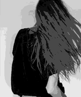 Black and white gif of a girl with long dark hair, in a black t-shirt, seen from behind as she gathers her hair into an updo — representing self-image and the 1st house in astrology.