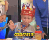 Moving image of a young boy wearing a crown celebrating