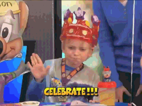 Moving image of a young boy wearing a crown celebrating
