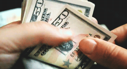 Moving image of a hand counting US $50 dollar bills to represent the 2nd house in astrology