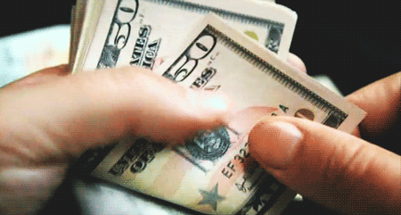 Moving image of a hand counting US $50 dollar bills to represent the 2nd house in astrology
