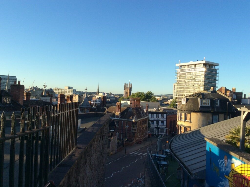 A phtograph of a upper view from Bristol city by raillings overview of buildings and the road. Upper Maudlin Street, City of Bristol.
