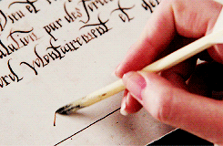 A moving image of a woman's hands signing a contract writing on papyrus scrolls, and scribes using a reed pens to symbolise the 7th house in astrology